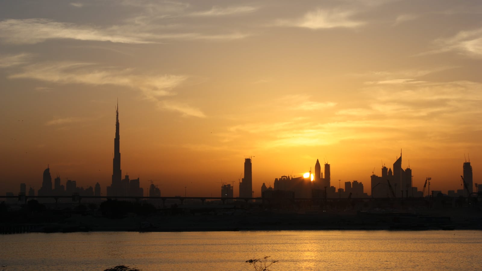 The Dubai skyline at sunset with the Burj Khalifa, United Arab Emirates